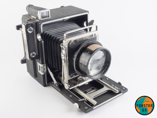A vintage Speed Graphic camera with a Dallmeyer Pentac lens attached, mounted on a forster uk lens board.